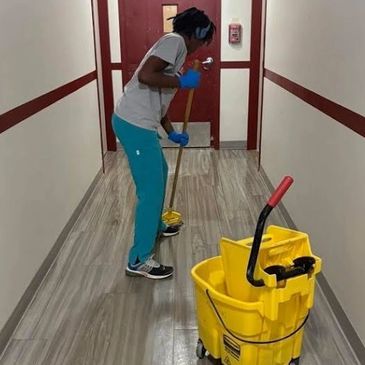 Employee working at commercial property. 