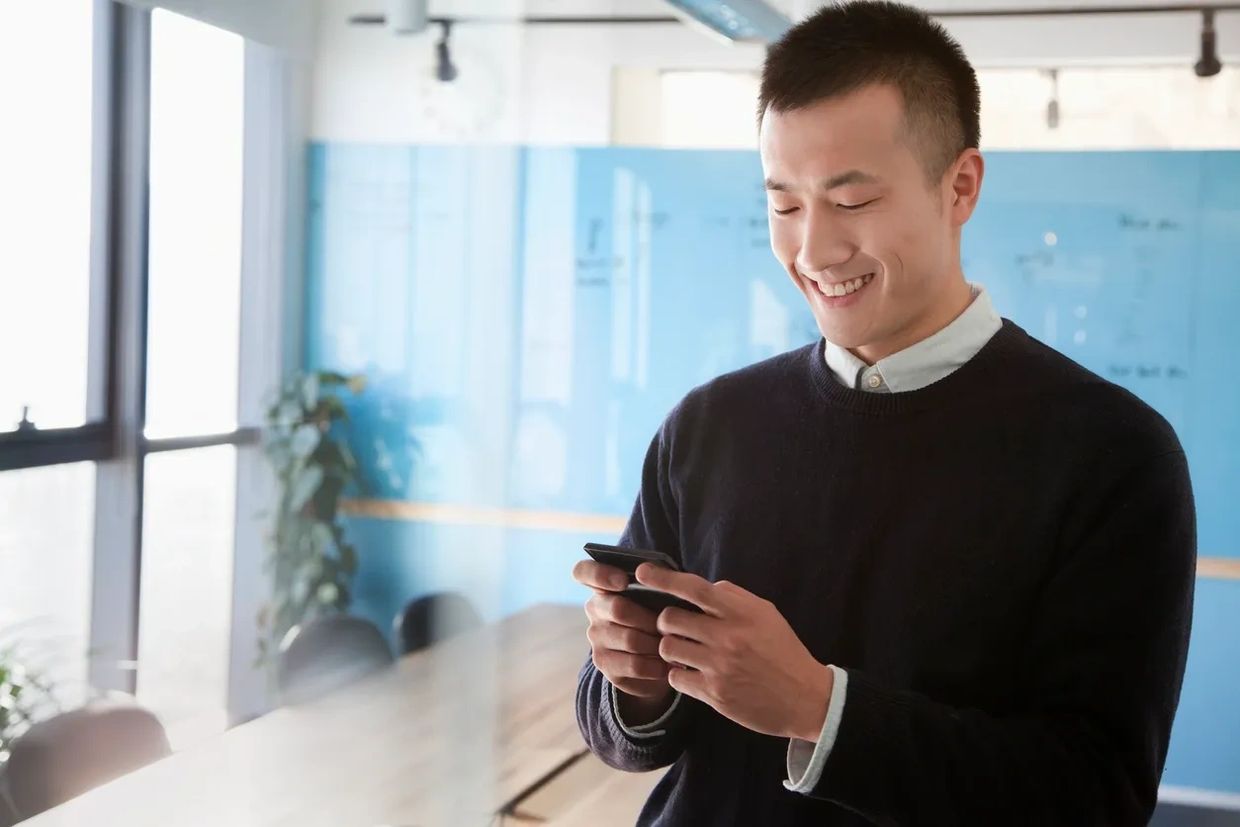 Tenant paying for rent using cell phone.