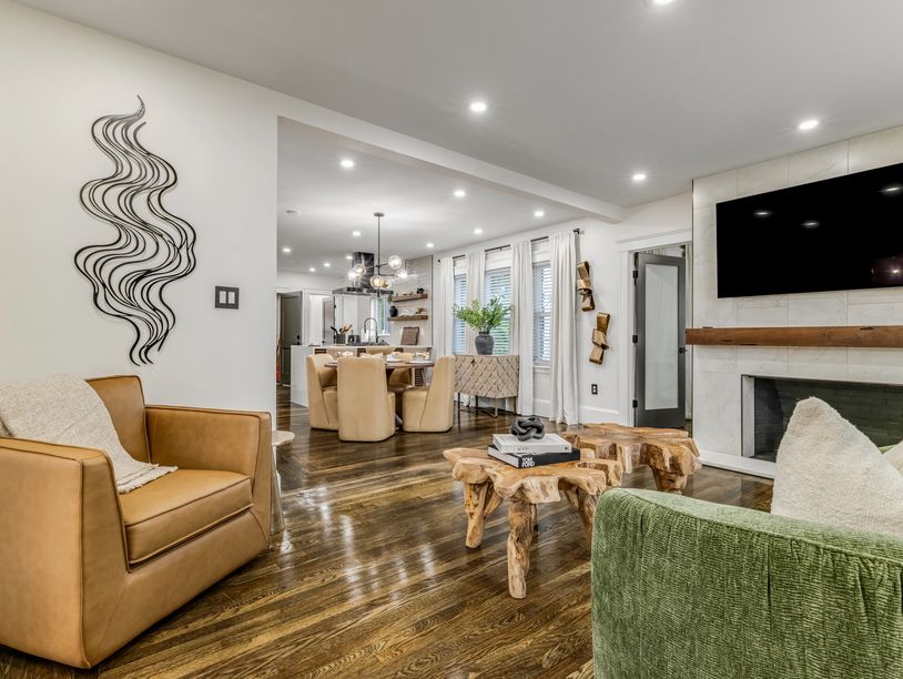 Modern living room with natural wood decor and neutral tones.
