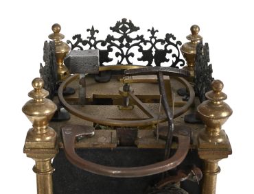 Antique mechanical device with brass and iron components.