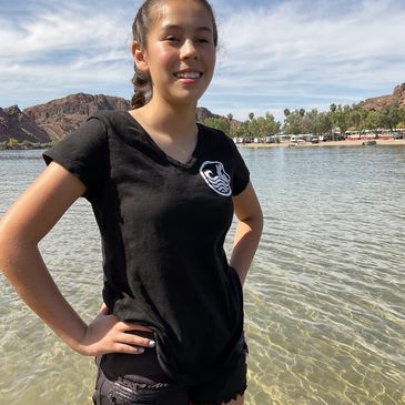 A girl smiling while standing in the water
