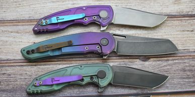 Custom anodized Jake Hoback mid tech knives.  A8, OSF, and MK Ultra.