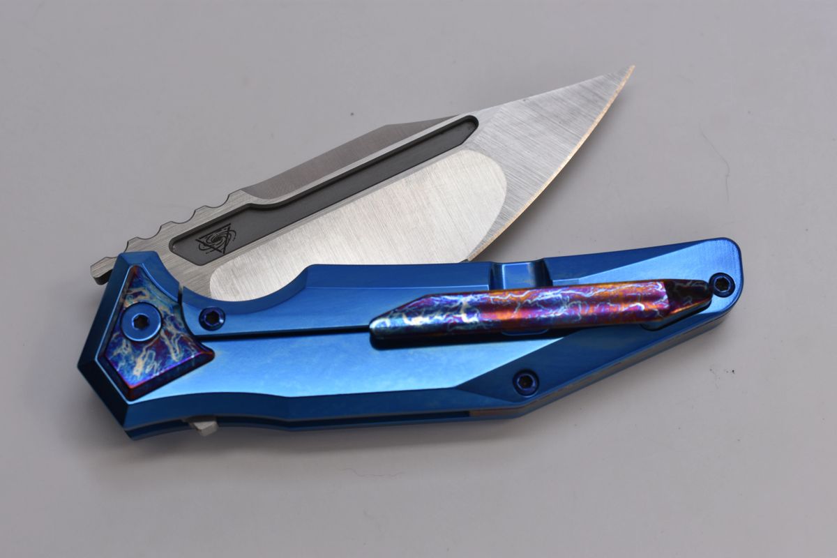 Arcane Design Abyss Polished and anodized a great blue on the scales