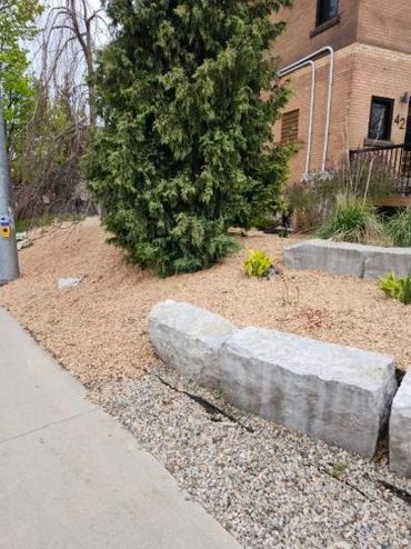 New mulch along garden barrier