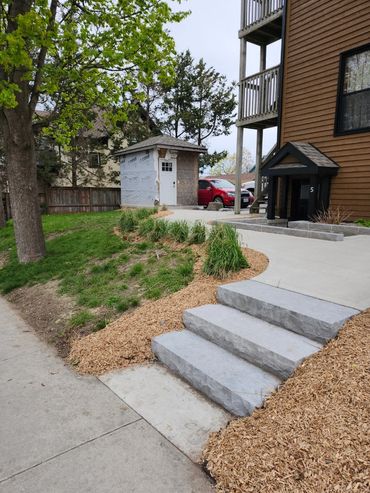 Mulched flower bed along stairs
