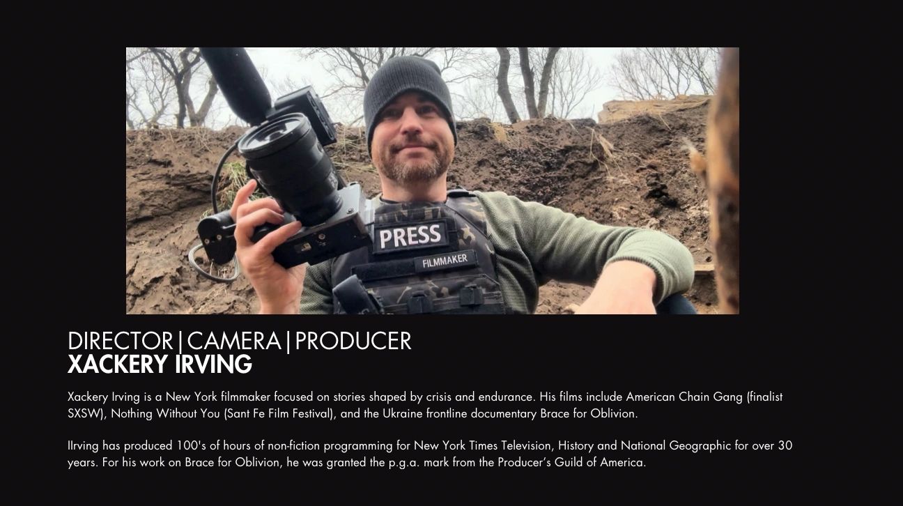 Xackery Irving, a filmmaker, holding a camera in a rugged outdoor setting.