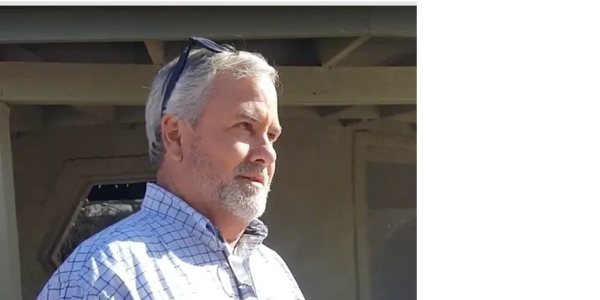 Jim Potts teaching a class on horticulture with his sunglasses outside. He is a master at vegetation