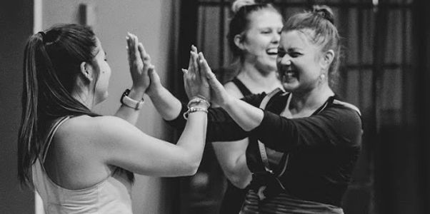 Adult Students giving High Fives after an awesome class!