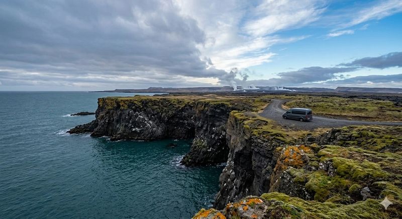 A 2Go Iceland van navigating a scenic coastal backroad on the Reykjanes Peninsula cliffs, showcasing your local knowledge and small group mobility.