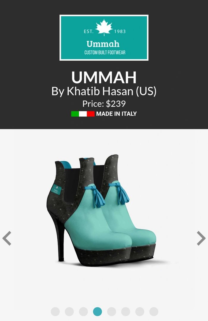 A stylish pair of high-heeled shoes in turquoise with black accents and tassels.