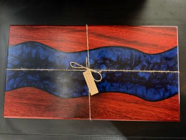 Decorative wooden box with resin inlay.