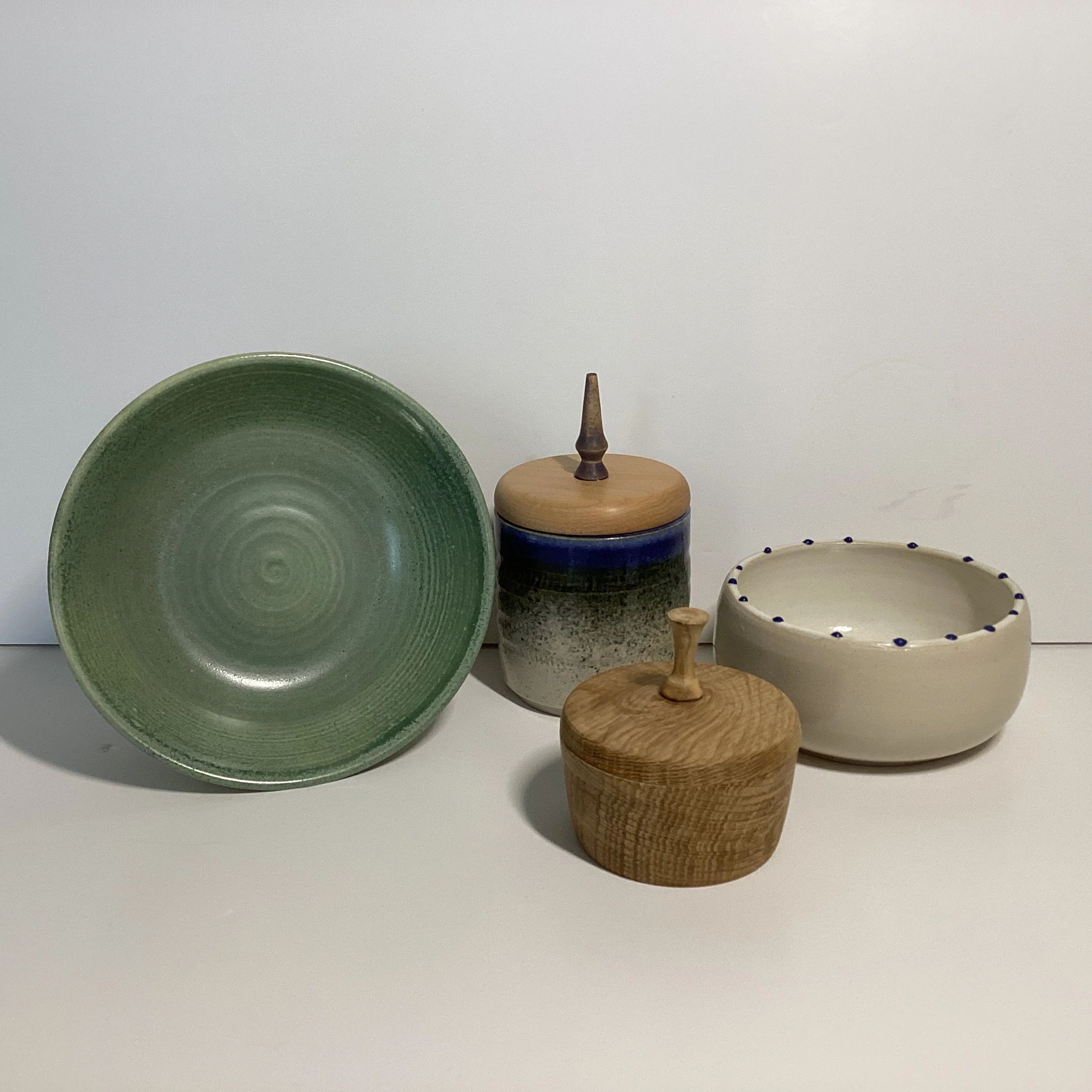 Ceramic plate and bowl and a wooden bowl with lid