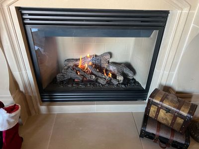 Gas fireplace lit with beautiful flame and radiant heat