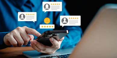 A vibrant sunset over a calm sea, with silhouettes of palm trees in the foreground.