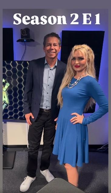 Two hosts posing in a studio for Season 2 Episode 1.