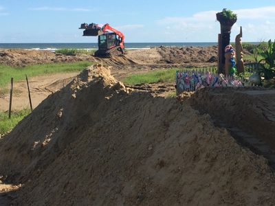 Restoration of dunes and repairs from recent storms.