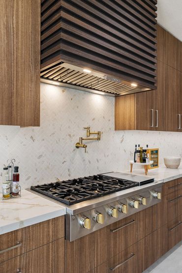 Modern kitchen design with integrated custom cabinets in Alboreto by Cleaf panels in Rancho Mirage