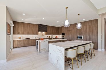 Modern kitchen design with integrated custom cabinets in Alboreto by Cleaf panels in Rancho Mirage