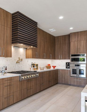 Modern kitchen design with integrated custom cabinets in Alboreto by Cleaf panels in Rancho Mirage