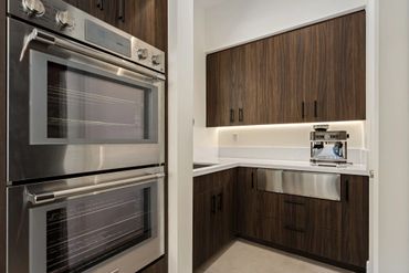 Milano by Cleaf used for custom cabinets in modern kitchen design for custom bedroom in Stone Eagle