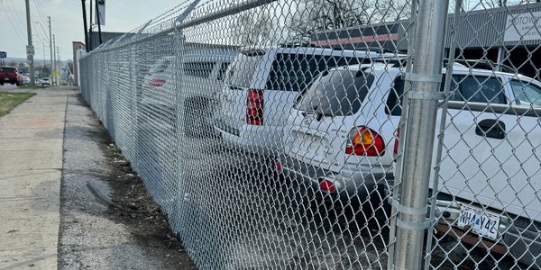 6' chainlink security fence new construction with barbed wire