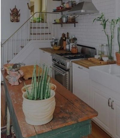 My tiny home kitchen with stairs leading up to my loft area.