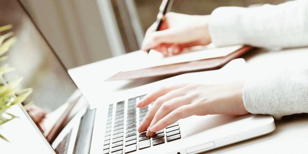 Pharmacist on a computer providing medication help
