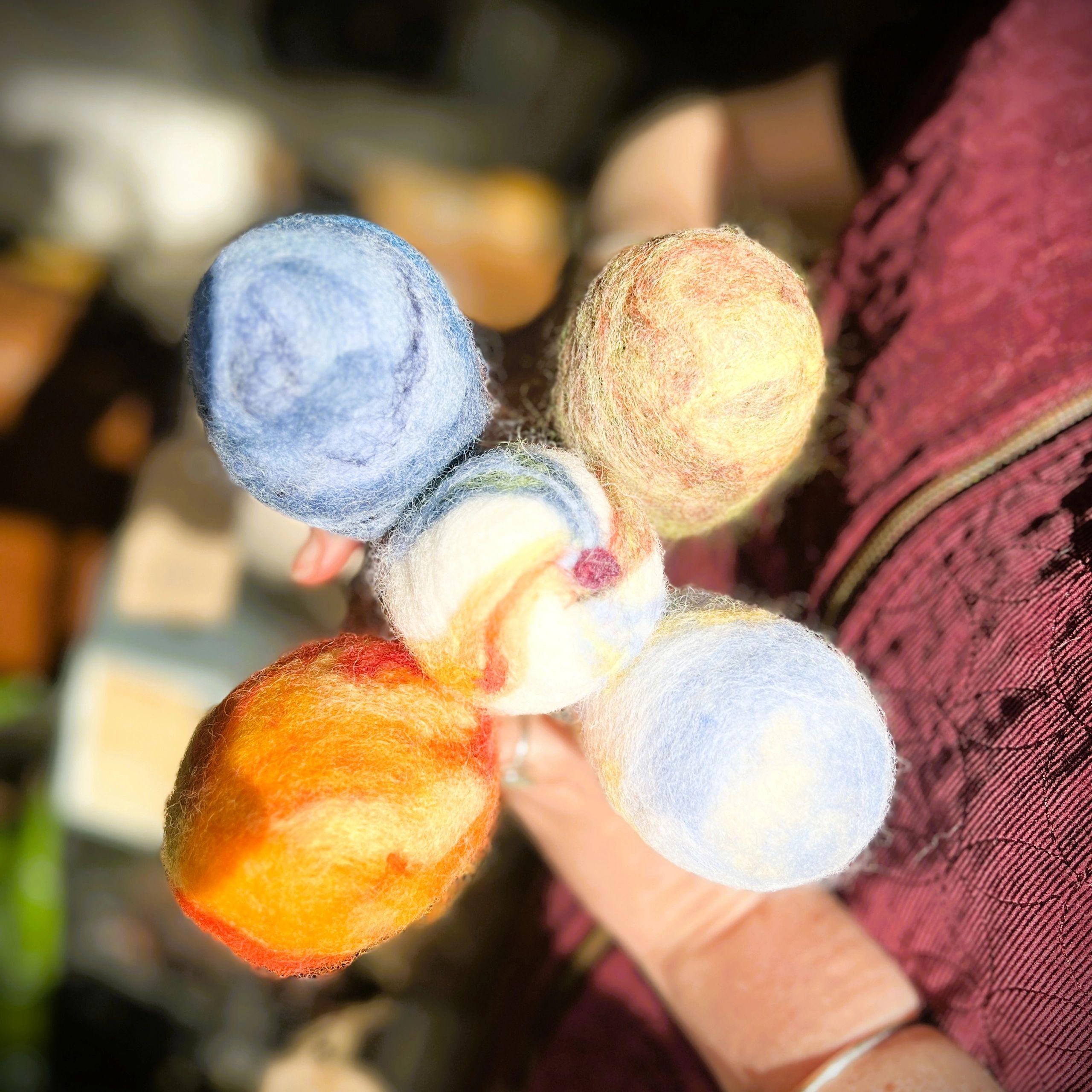 5 Felt beater heads representing earth, air, fire and water, with spirit at the centre.