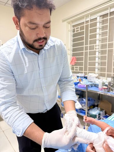 Doctor applying pop cast for baby. 