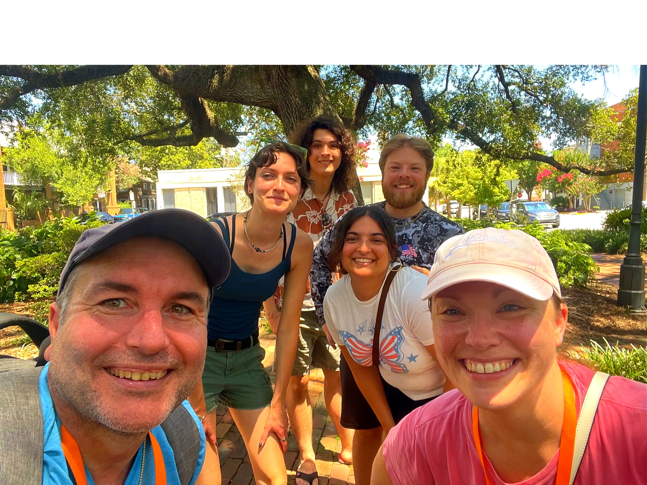 Return guests with Melissa and Jeremy on tour, smiling in Columbia Square.