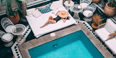 Lady sitting by the pool in Marrackesh