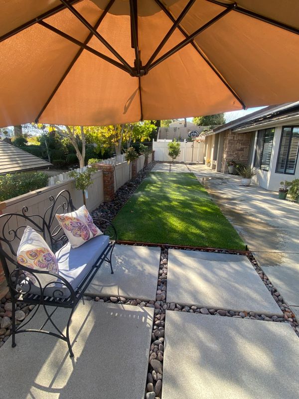 Seating  area on large square concrete stepping stones with Arizona river rock in between