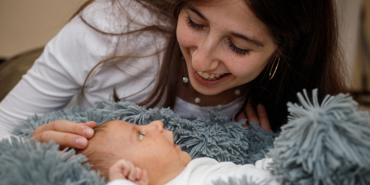 Mother smiling to baby