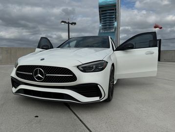 White Mercedes for Rent in South Florida. Luxury Car rental with red leather seats.