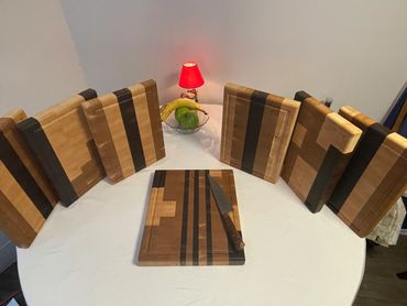 End Grain cutting boards. 
You can choose from wood type and design.