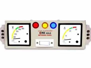 Electrical metering panel with voltage and current gauges and indicator lights.