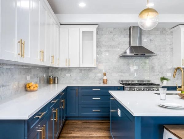 Modern kitchen with blue lower cabinets and white upper cabinets.