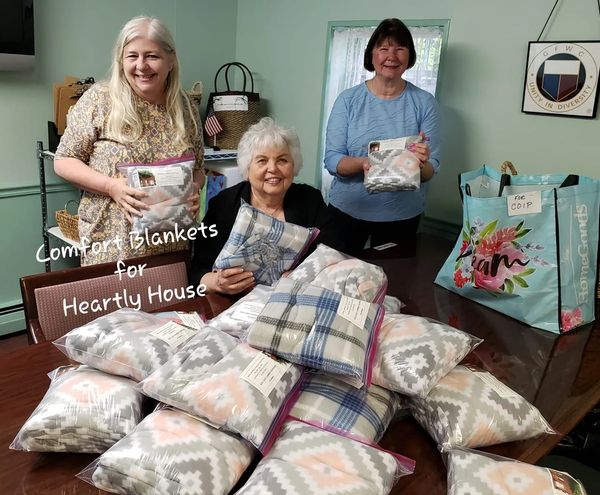 Club members bagging Comfort Blankets for the Heartly House.