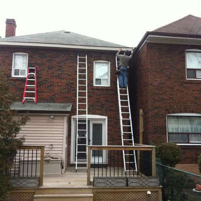 Residential gutter repair underway on a Brampton home