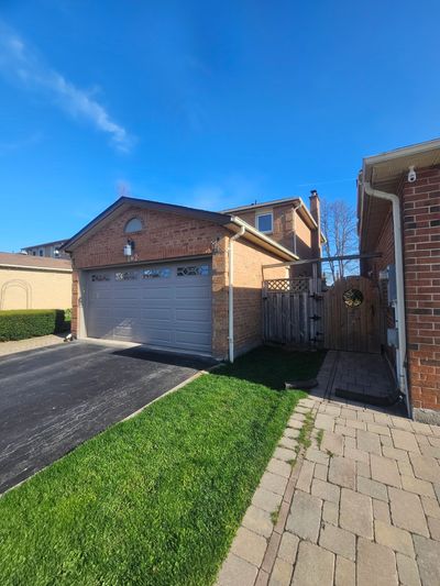 Gutter repair work being performed on a residential home in Richmond Hill