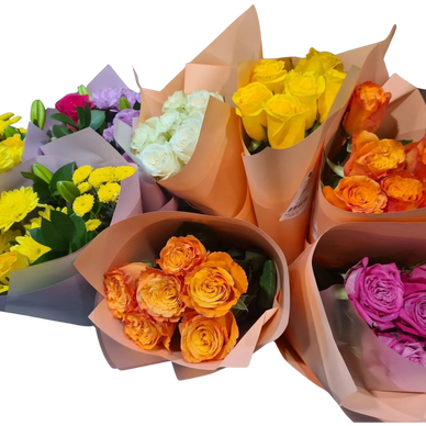 Colorful bouquets of roses and chrysanthemums wrapped in paper.