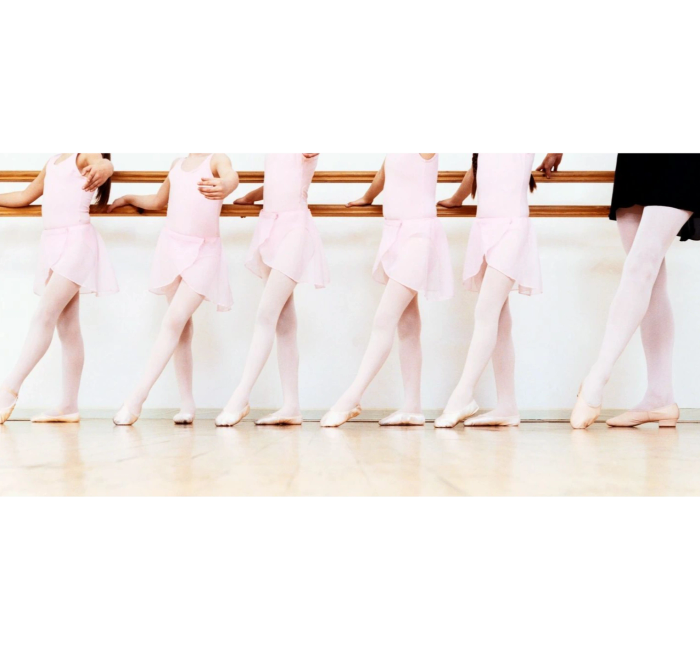 Young ballet dancers at the barre