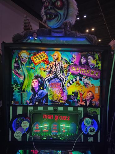 Beetlejuice themed pinball machine with colorful artwork.