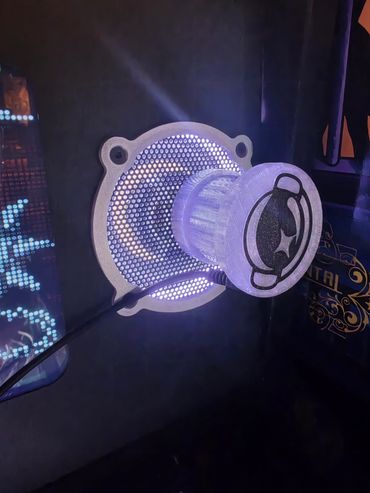 Glowing futuristic device with purple lights.