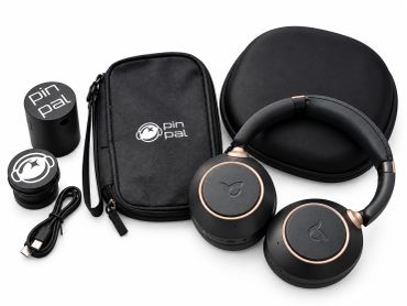 Wireless headphones with accessories including case and cables.