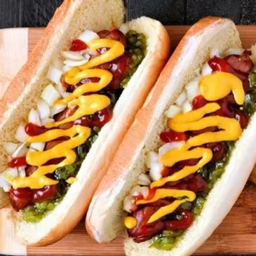 Hot dogs with ketchup, mustard, relish, onion and chips
