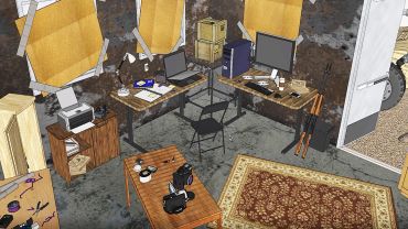 A cluttered underground workspace with computers and tools.