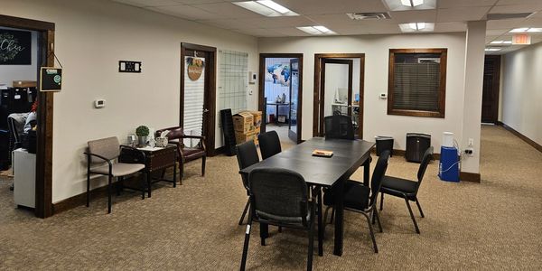 Office room with table and chairs.