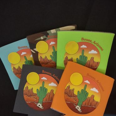 Colorful Bouse, Arizona drink koozies with desert sunset and cactus design.