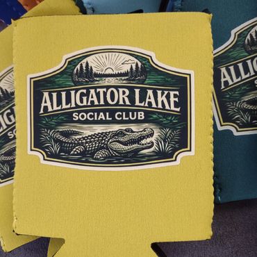 Yellow drink cozy with Alligator Lake Social Club logo and alligator image.